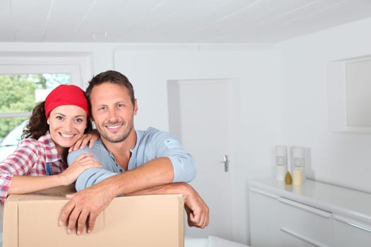 Closeup of couple resting on boxes