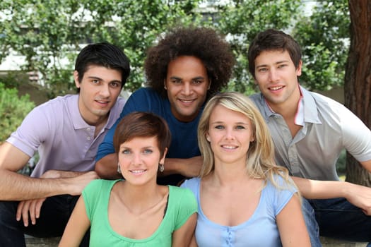 Group of happy students in a park