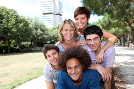 Group of happy students in a park