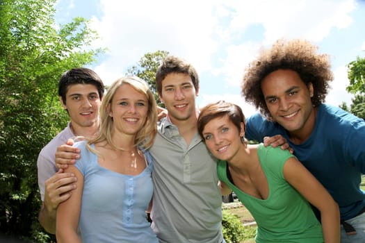 Group of happy students in a park