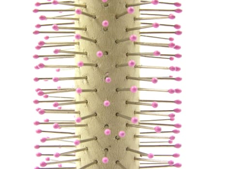 Close-up of a round brush on a white background