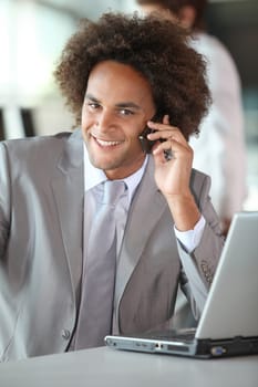 Closeup of happy businessman in the office