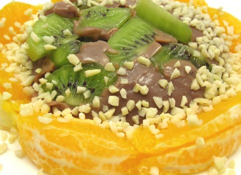 Chocolate pudding with kiwi,orange and almonds