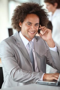 Closeup of happy businessman in the office