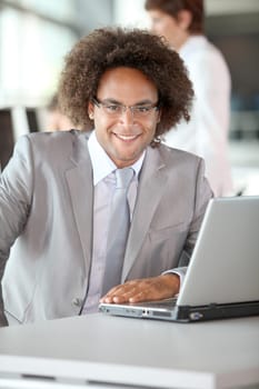 Closeup of happy businessman in the office