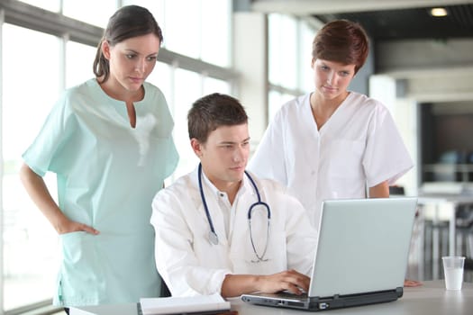 closeup of doctor and nurses in a meeting
