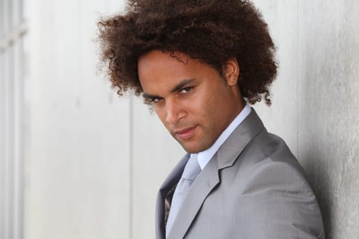 Portrait of a businessman in grey suit