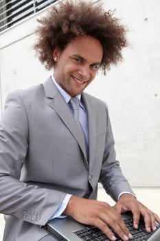 Young businessman working oustide the office