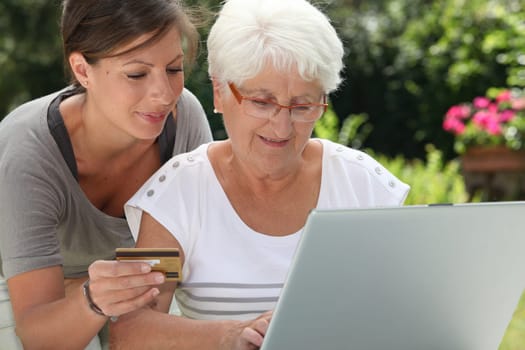 elderly woman doing shopping on internet