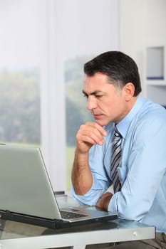 Businessman in the office working on laptop computer