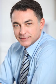 Closeup of businessman with blue shirt and tie