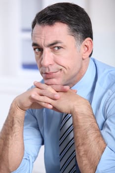 Closeup of tired businessman in the office