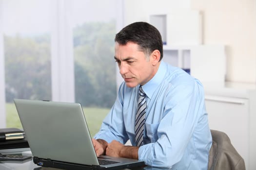 Businessman working on laptop computer