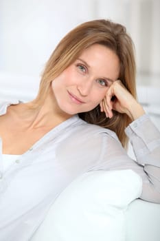 Closeup of beautiful blond woman relaxing at home