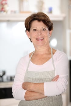 Closeup of senior woman standing in kitchen