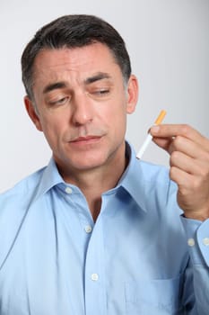 Closeup of man trying to quit smoking