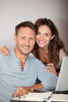 Couple at home surfing on internet