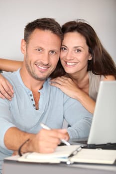Couple at home surfing on internet
