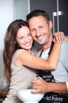 Couple having fun cooking at home