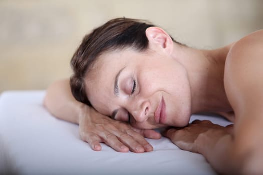 Woman relaxing on a massage bed