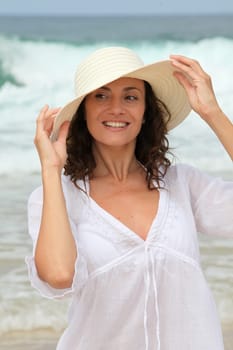 Closeup of beautiful woman wearing straw hat