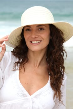 Closeup of beautiful woman wearing straw hat