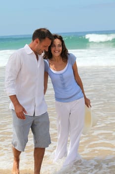 Couple walking on the beach