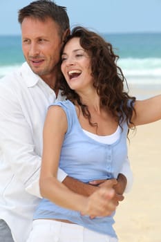 Couple walking on the beach