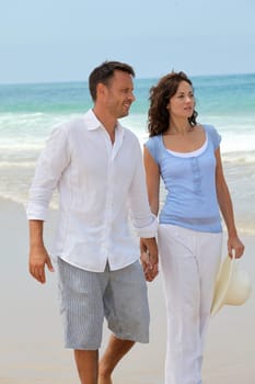 Couple walking on the beach