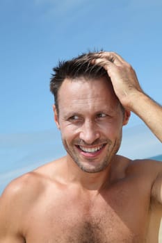Closeup of handsome man at the beach