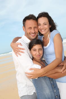Portrait of happy family at the beach