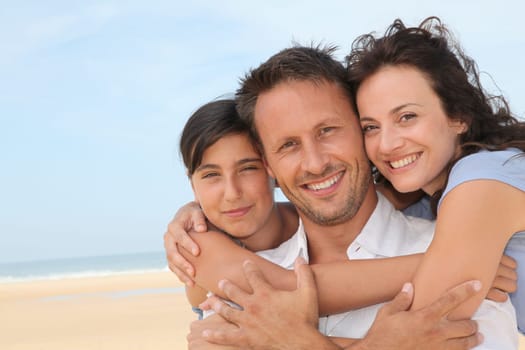 Portrait of happy family at the beach