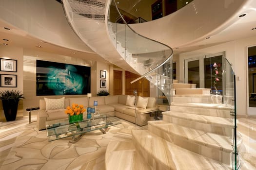 Luxurious modern living room with elegant spiral staircase and contemporary decor.