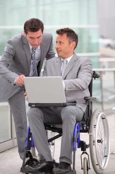 Man in wheelchair in business travel