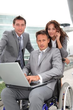 Man in wheelchair in business travel