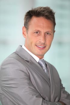 Portrait of businessman in grey suit
