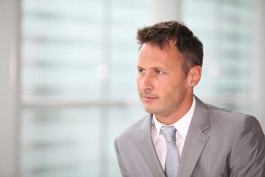 Portrait of businessman in grey suit