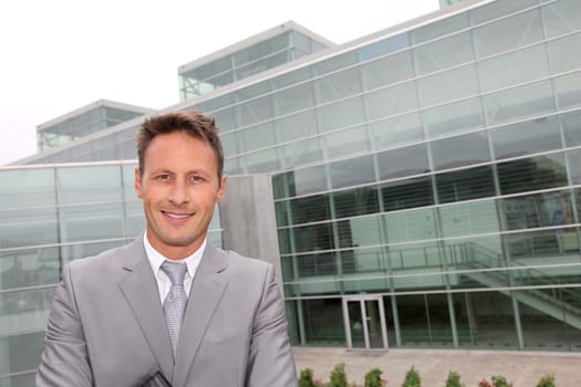 Portrait of businessman in grey suit