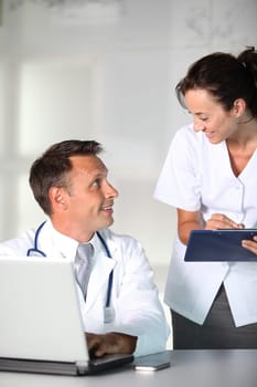 Doctor and nurse working in the office