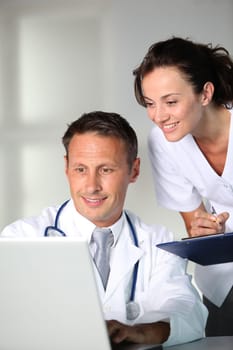 Doctor and nurse working in the office