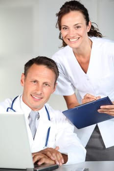 Doctor and nurse working in the office