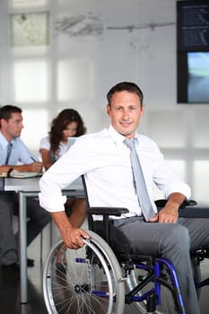 Businessman in wheelchair in the office