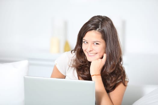 Closeup of teenager girl with laptop computer