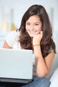 Closeup of teenager girl with laptop computer