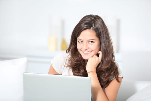 Closeup of teenager girl with laptop computer