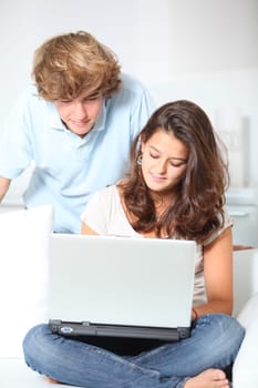 Teenagers with laptop computer