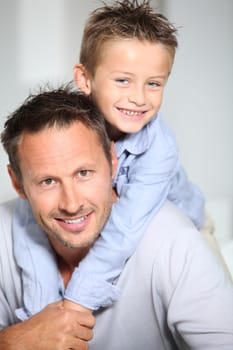 Closeup of father and son at home
