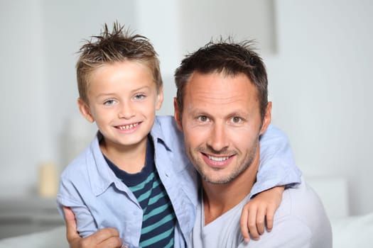 Closeup of father and son at home
