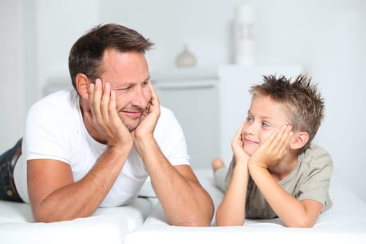 Closeup of father and son at home