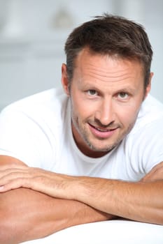 Man with arms crossed looking at camera